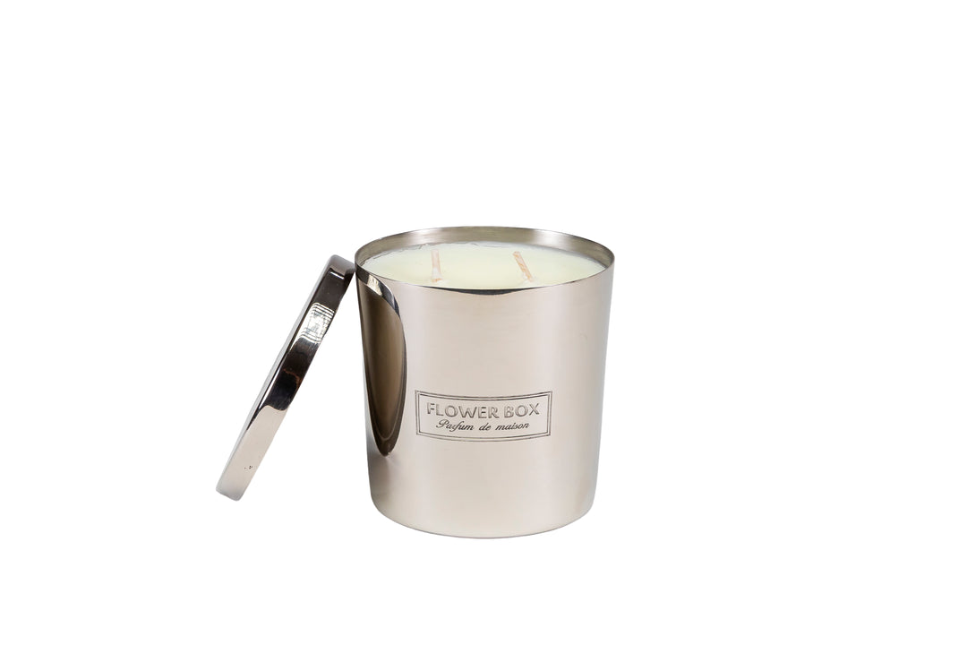 Silver candle holder with a candle inside on a white background