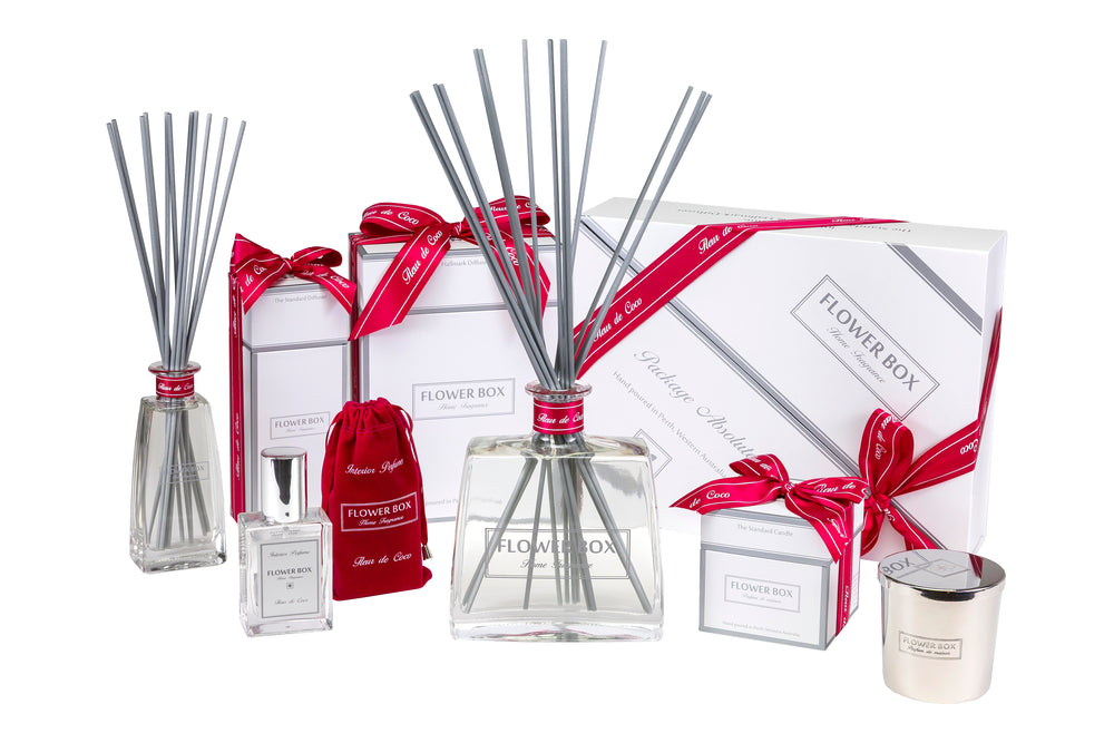 Flower Box  reed diffuser home fragrance gift package set with bottles, sticks, and a candle on a white background