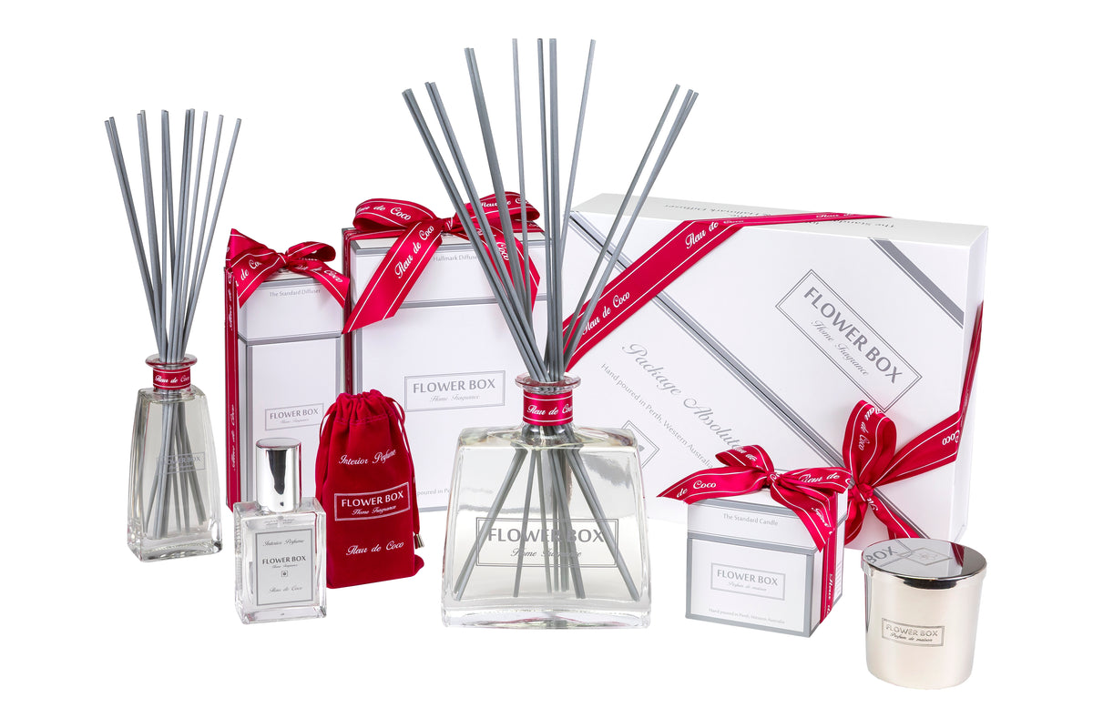 Flower Box  reed diffuser home fragrance gift package set with bottles, sticks, and a candle on a white background