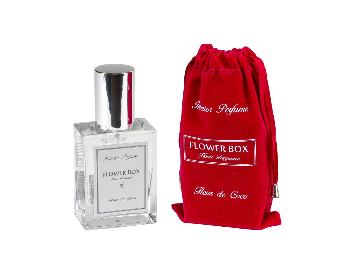 Interior perfume spray bottle with silver cap and red drawstring bag labeled 'Flower Box' on a white background