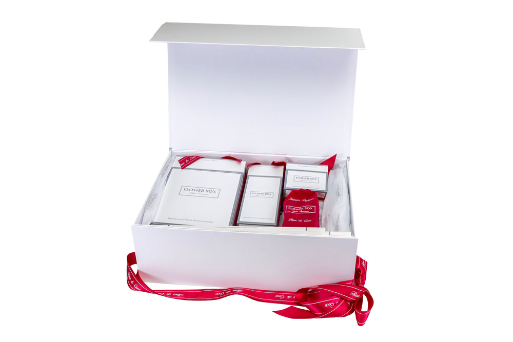 Gift set with homeware fragrance products in a white box on a white background